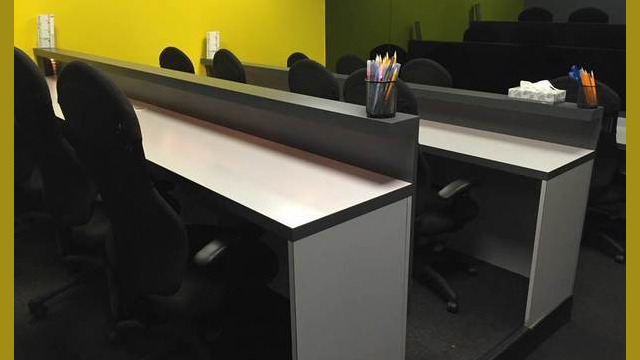Focus group facility viewing room showing tiered seating for viewers.